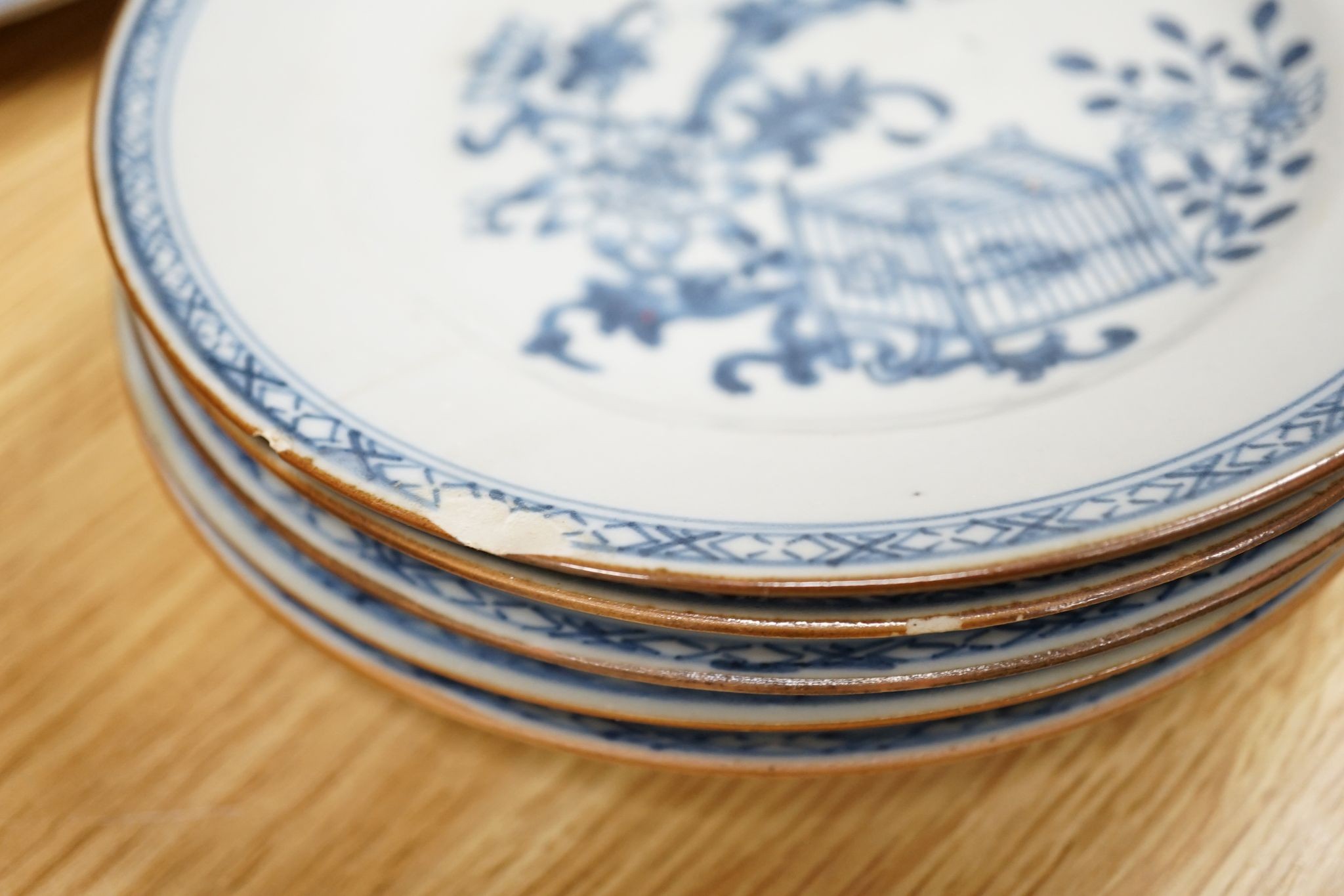 A Set of six 18th century Chinese export blue and white ‘bird in a cage’ small plates, 6.3 cm diameter and two pairs of 18th century Chinese export blue and white plates dishes, largest 23cm diam (10)
